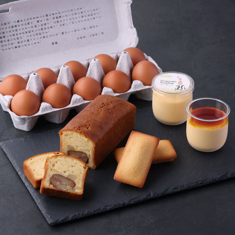 和栗の渋皮煮をごろっと贅沢に敷き詰めて焼き上げた和栗のパウンドケーキに、人気のぷりんやフィナンシェ、天美卵を詰め合わせたセット