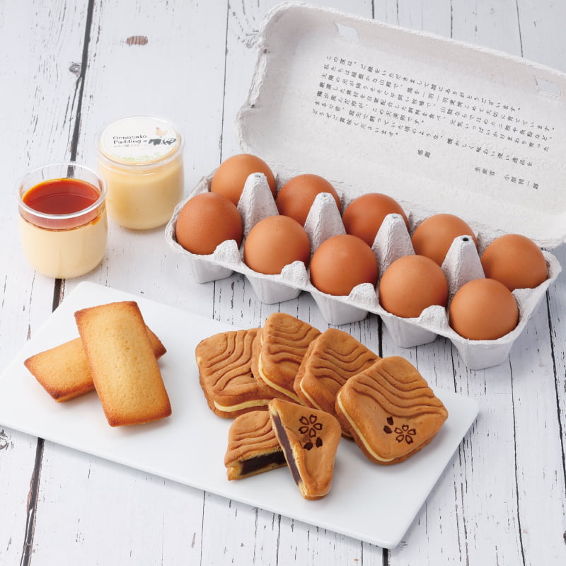 春限定「風紋まんじゅう桜こしあん」をはじめ、定番人気のぷりんやフィナンシェ、新鮮な天美卵を詰め合わせ。