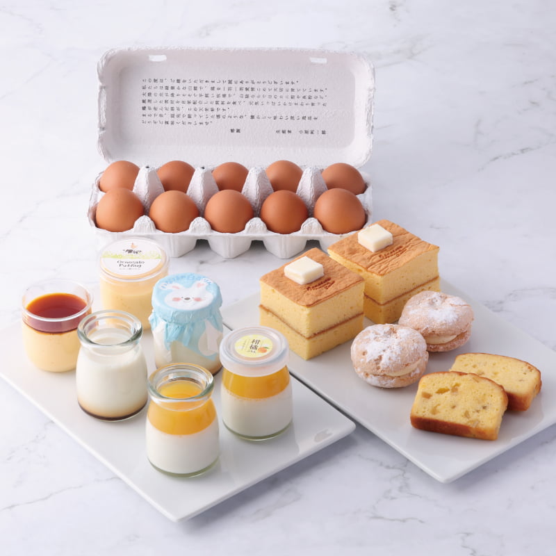 夏限定の柑橘ぷりんやトロピカルダックワーズをはじめ、人気のぷりんや焼き菓子、牧場自慢の天美卵を詰め合わせ。