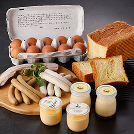 ぷりん2種と人気の牧場商品を詰め合わせ♪ 牧場自慢の天美卵をはじめ、人気のデニッシュブレッドと燻製商品のベーコンとソーセージ２種をセット。 さらに、食べ比べもできる大江ノ郷ぷりんとフロマージュぷりんをダブルで詰めました。